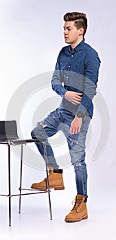 Male model in denim jeans and boots.