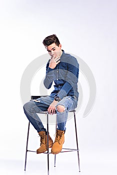 Male model in denim jeans and boots.