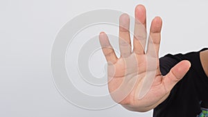 Male model is doing stop hand sign by showing five finger