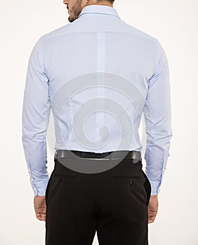 Male model with elegant black pants, belt and blue shirt