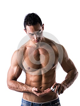 Male model putting cream in his hand