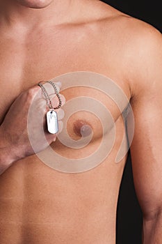 male model topless with a military identifica