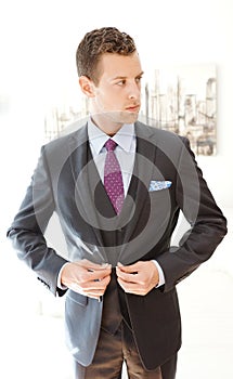 Male Model Wearing A Grey Three Piece Suit