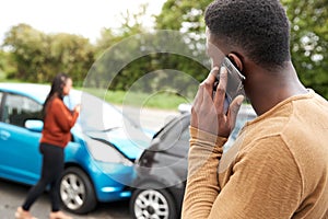 Male Motorist Involved In Car Accident Calling Insurance Company Or Recovery Service