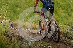 male mountain bike cyclist riding on cross-country cycling