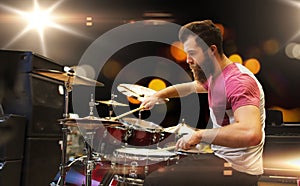 Male musician playing cymbals at music concert photo