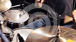 Male musician playing drums and cymbals at concert