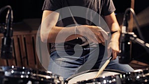 Male musician playing drums and cymbals at concert