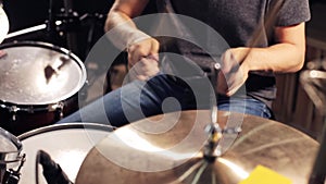 Male musician playing drums and cymbals at concert