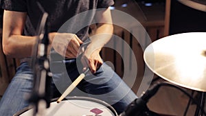 Male musician playing drums and cymbals at concert