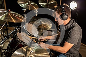 Male musician playing drums and cymbals at concert