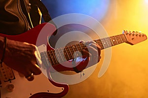 Male Musician Playing Electric Guitar on Stage