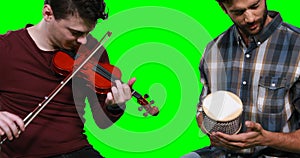 Male musicians playing violin and cabasa
