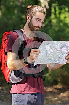 male nature explorer reading nthe map