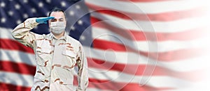 Male Navy Medical Personnel Saluting Wearing Personnel Protective Equipment PPE With American Flag Background Banner