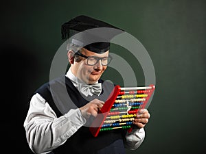 Male nerd holding abacus