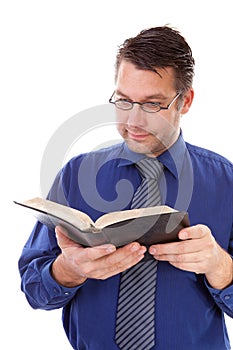 Male nerdy geek is reading a book