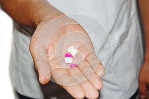 A male nurse with medication in his hand