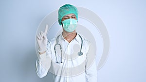 A male nurse showing disagreed gesture on a white background