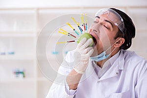 Male nutrition expert testing food products in lab