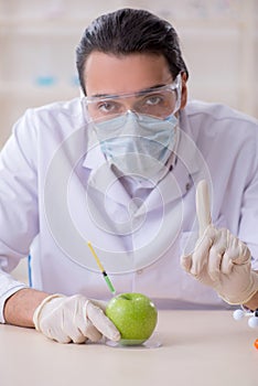 Male nutrition expert testing food products in lab