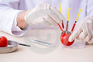 Male nutrition expert testing food products in lab