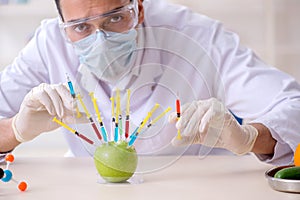 Male nutrition expert testing food products in lab