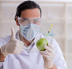 Male nutrition expert testing food products in lab