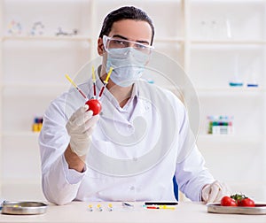 Male nutrition expert testing food products in lab