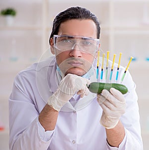 Male nutrition expert testing food products in lab