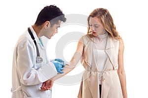 Male octor making injection of young woman