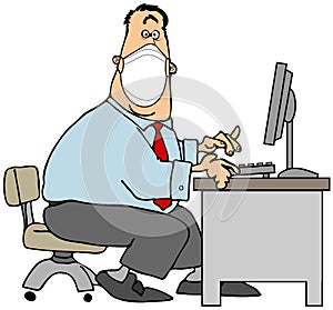 Male office worker sitting at a computer and wearing a face mask