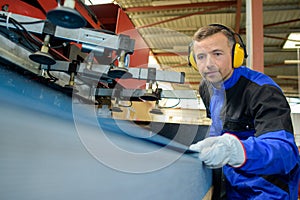 male operative using machinery photo