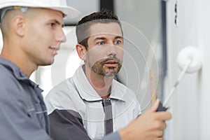 Male painter and apprentice