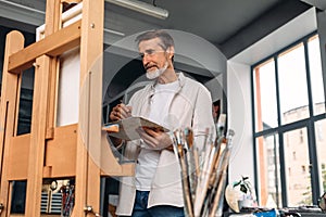 Male painter standing in his studio