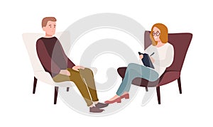 Male patient in armchair and female psychologist, psychoanalyst or psychotherapist sitting in front of him and talking photo