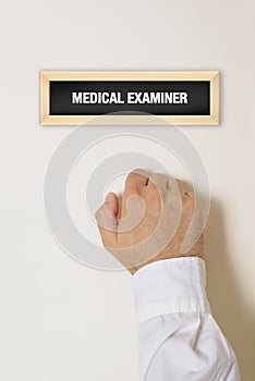 Male patient knocking on Medical Examiner door