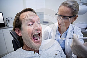 Male patient scared during a dental check-up