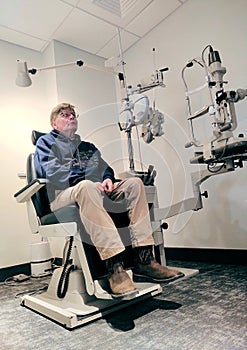 Male Patient Sitting in an Eye Doctor Exam Room