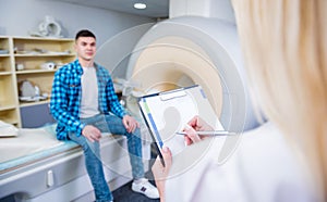 Male patient talking to doctor before mri scan