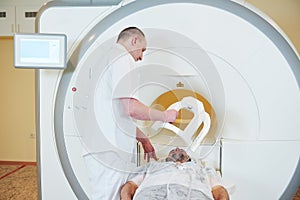 Male patient undergoing MRI - magnetic resonance imaging or computed tomography in hospital photo