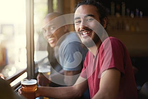 Male people, beer and chill at pub, smile and relax indoor for fun and bonding in summer to destress. Friends, bar and