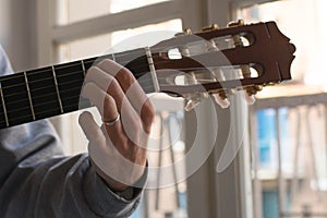 Male performer guitar player, hand focus