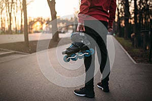 Male person hands with roller skates