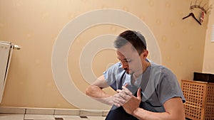 Male physiotherapist massaging the leg of a patient in the physiotherapy room. Treatment, massage, rehabilitation