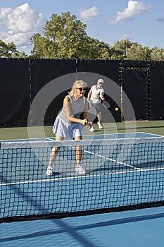 Male Pickleball Player Returns Serve