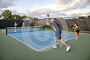 Male Pickleball Player Serving