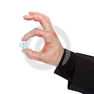 Male polygonal hand between two fingers holding a snowflake