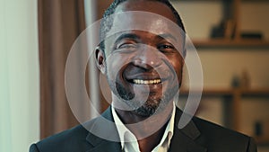 Male portrait adult successful african american businessman posing indoors joyful positive man client looking at camera