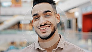 Male portrait close up headshot Indian man bearded Ethnic guy looking at camera smiling flirting adult bearded smile